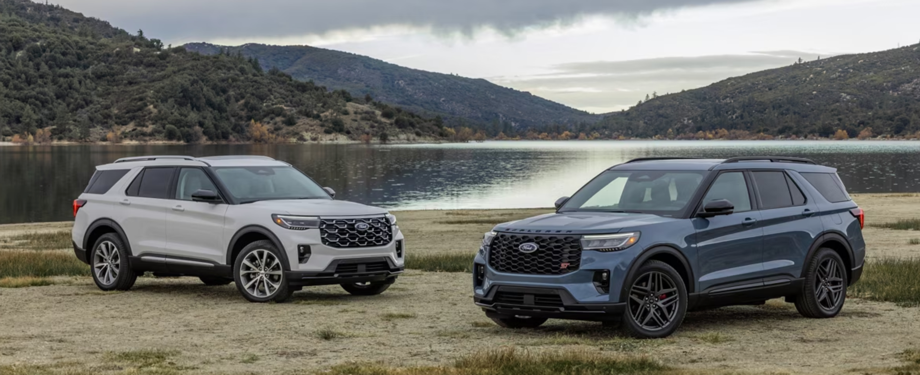 Two Ford Explorer SUVs parked together