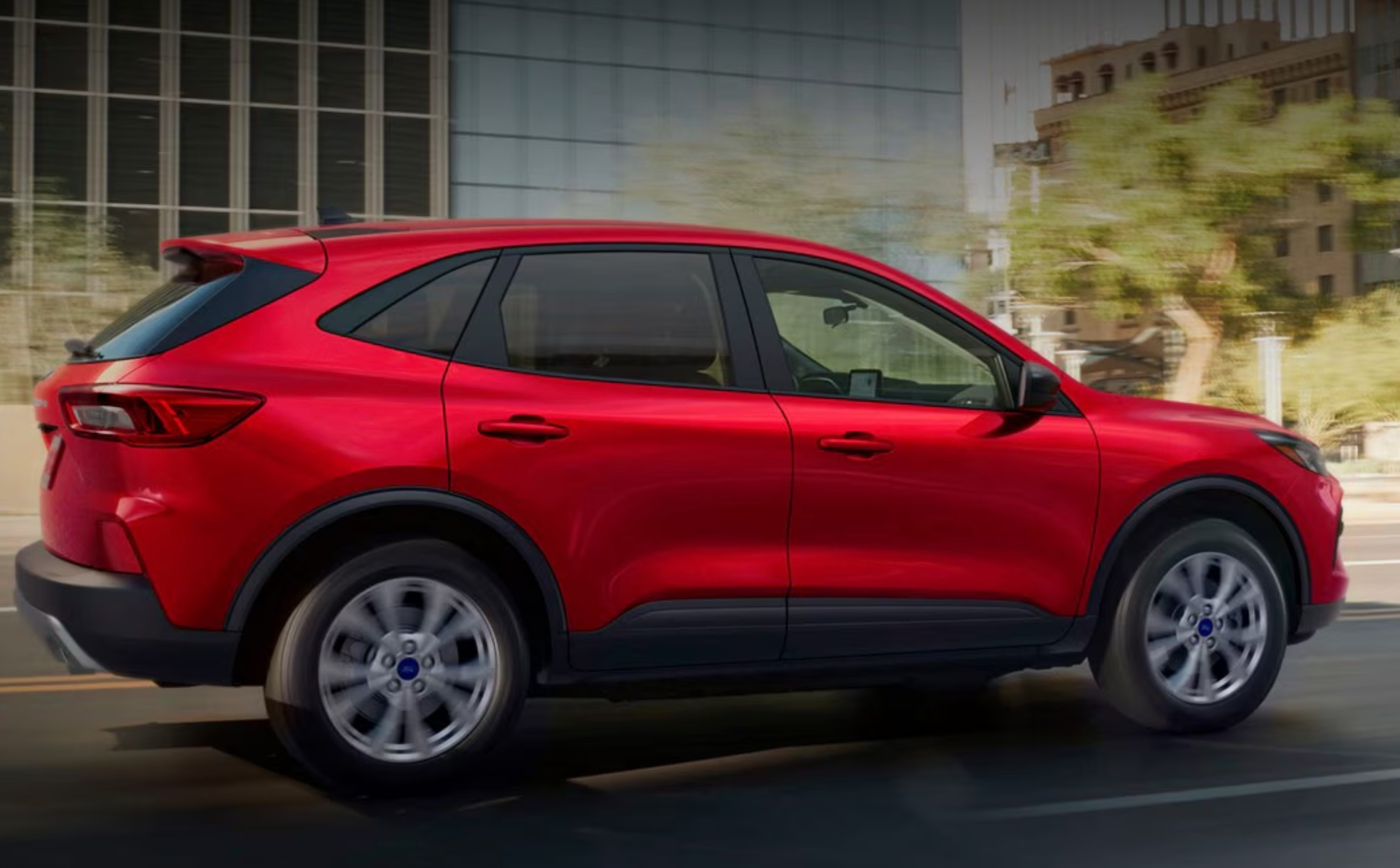 Red 2025 Ford Escape driving